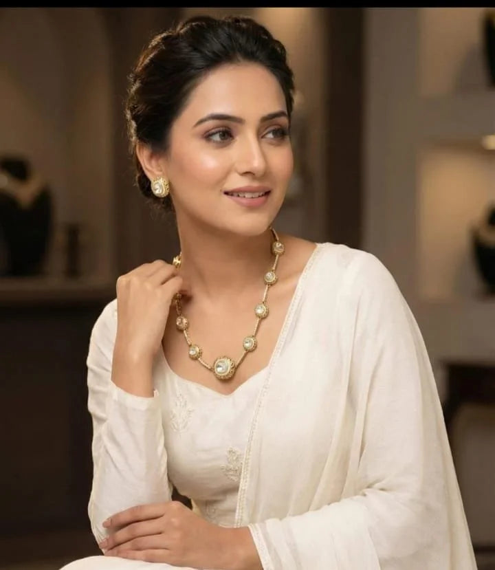 Model wearing Mukthi Sleek moissanite polki necklace set in matt gold finish