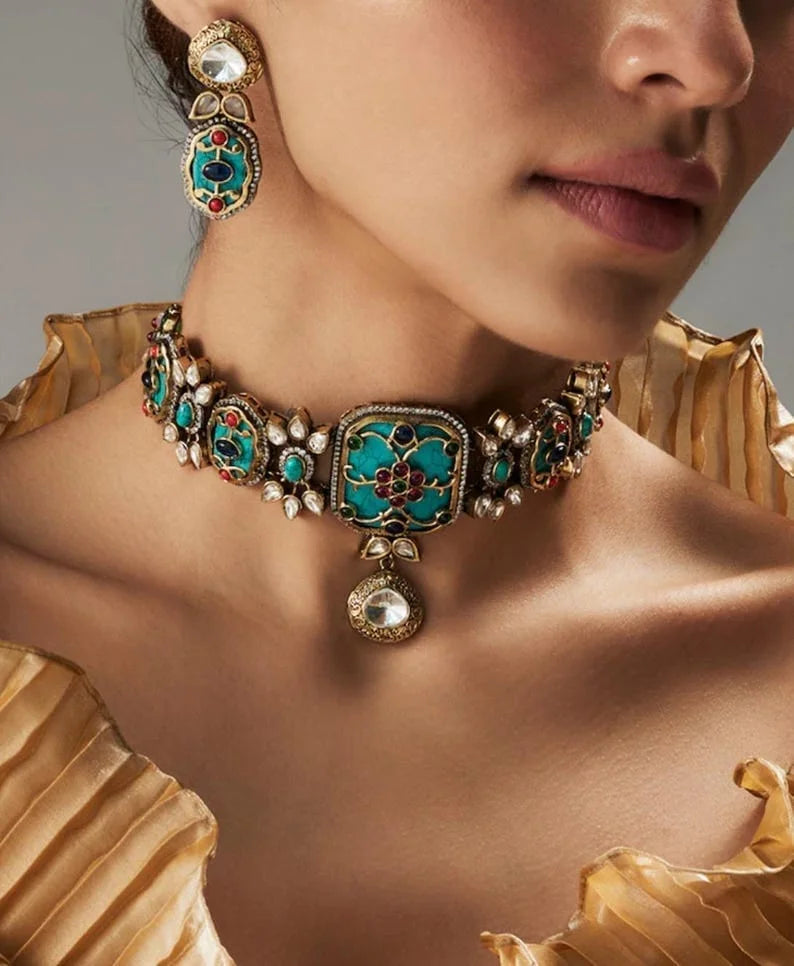 A luxurious Navratan choker inspired by traditional Amrapali designs with semi-precious stones.